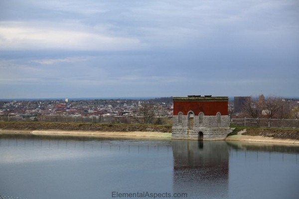 stone and brick intake on edge of city water reservoir